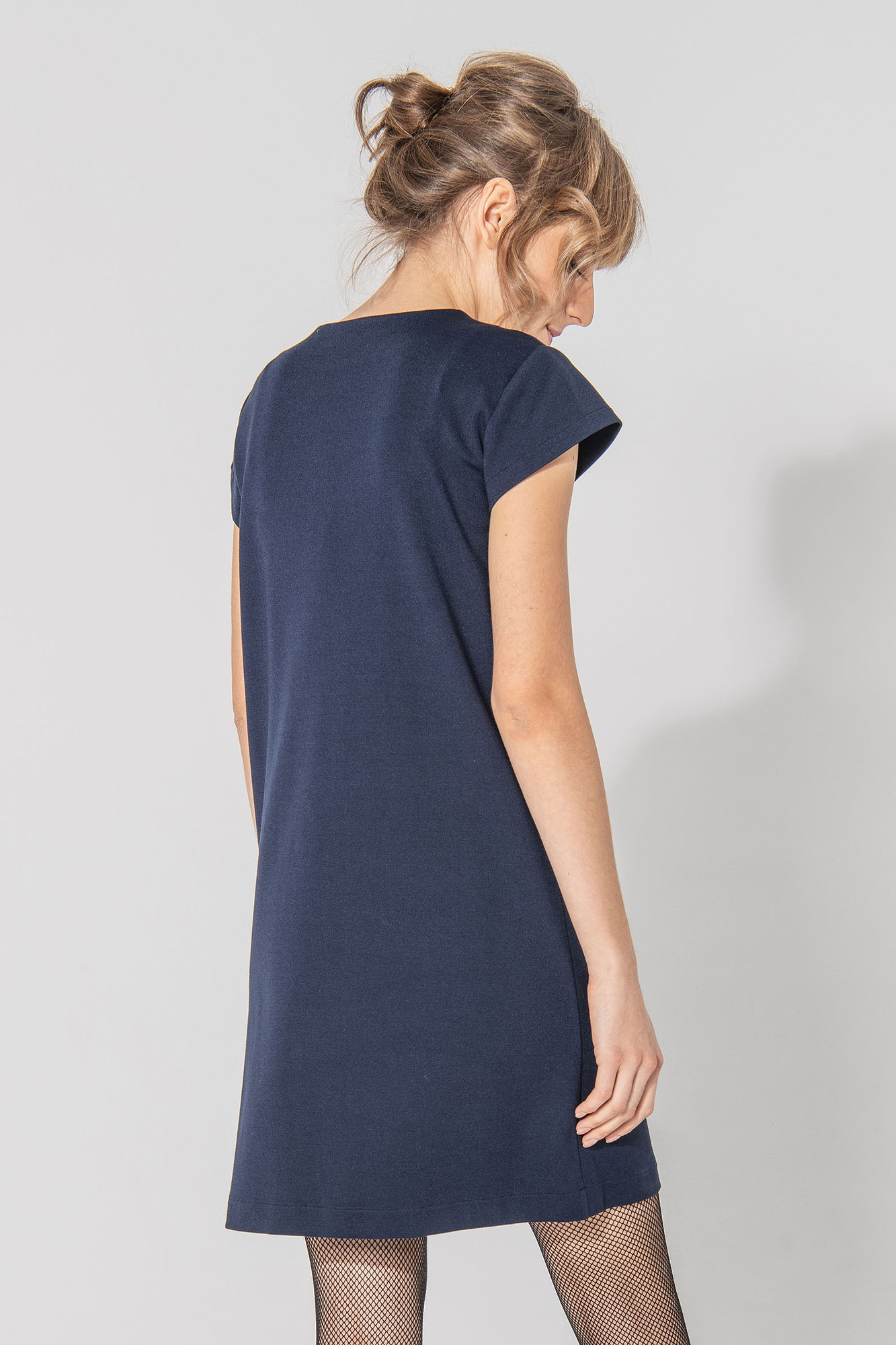Dark blue trapeze dress with big front pockets back • Sassa Björg