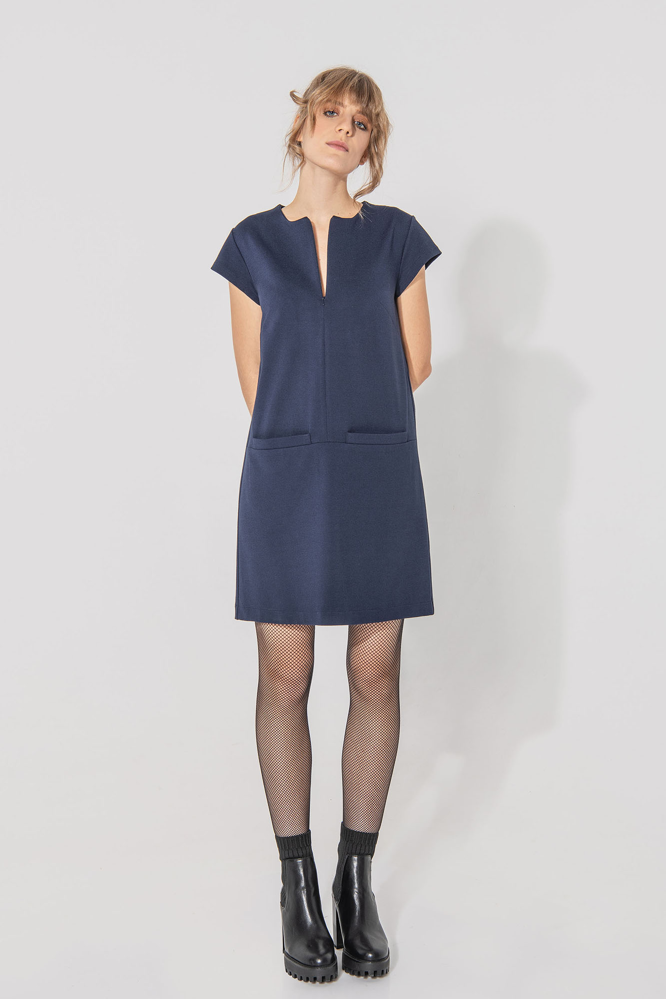 Dark blue trapeze dress with big front pockets front • Sassa Björg