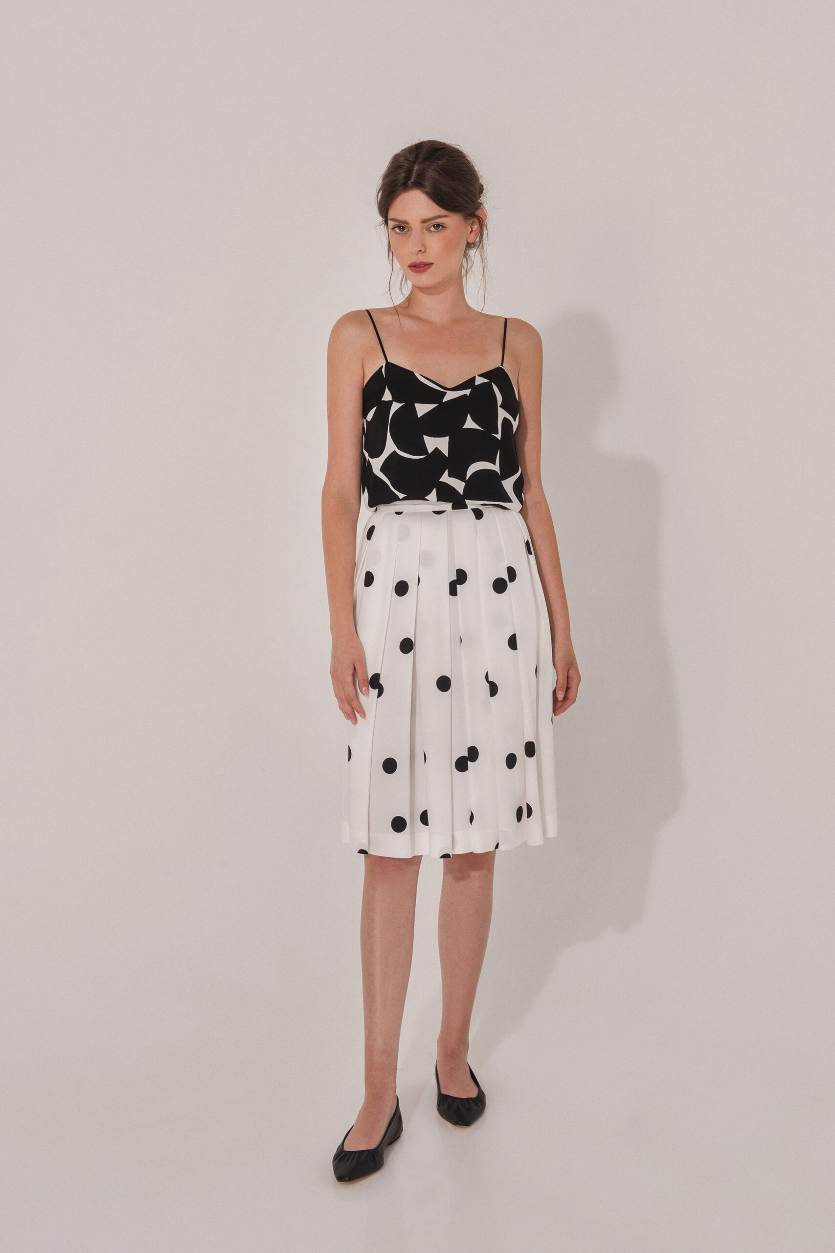 Polka dot skirt with two sided pleats front scaled • Sassa Björg