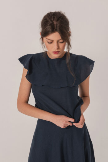 Navy blue linen blouse with a ruffle close up • Sassa Björg