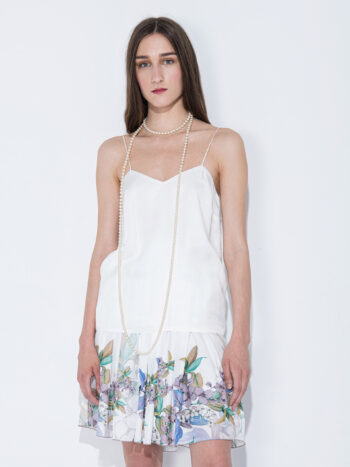 white skirt w flower border front • Sassa Björg
