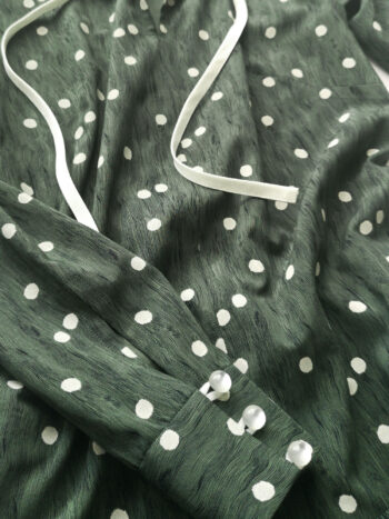 Playful green wavy pattern dress closeup • Sassa Björg