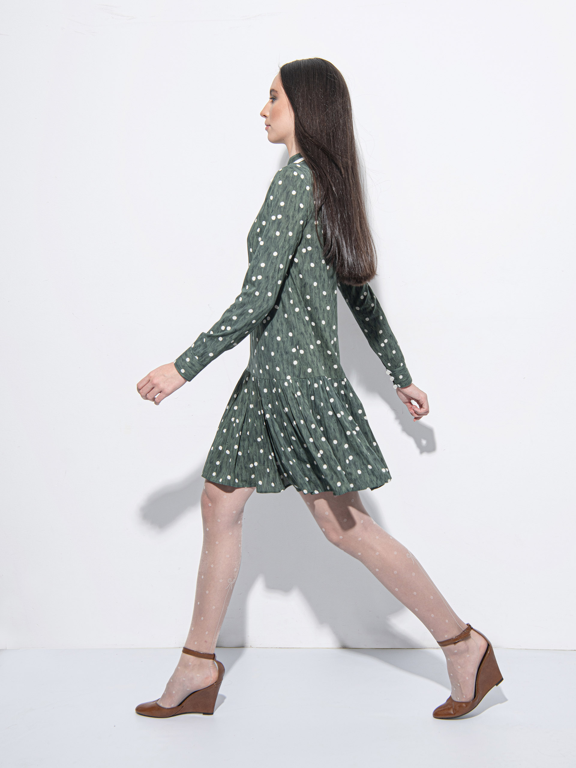 Playful green wavy pattern dress walking • Sassa Björg